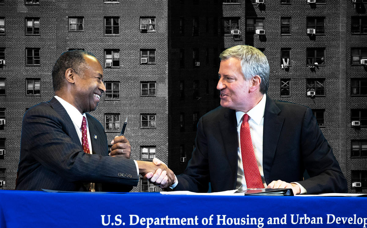Ben Carson and Mayor Bill de Blasio shake hands after signing an agreement intended to correct mismanagement of the NYCHA (Credit: Getty Images)