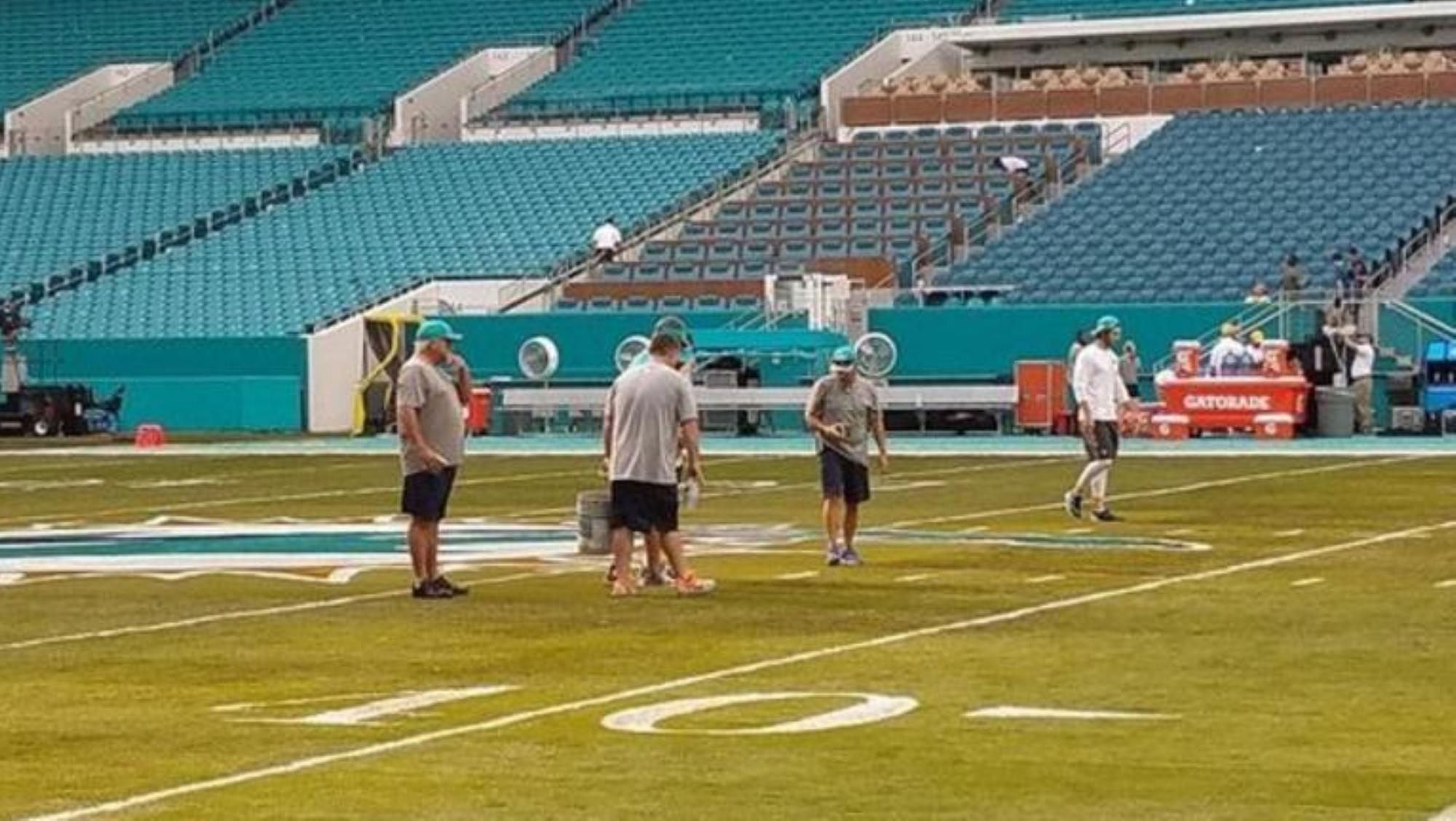 Hard Rock Stadium grounds crew working on the Dolphins home field (Credit: NBC Sports)