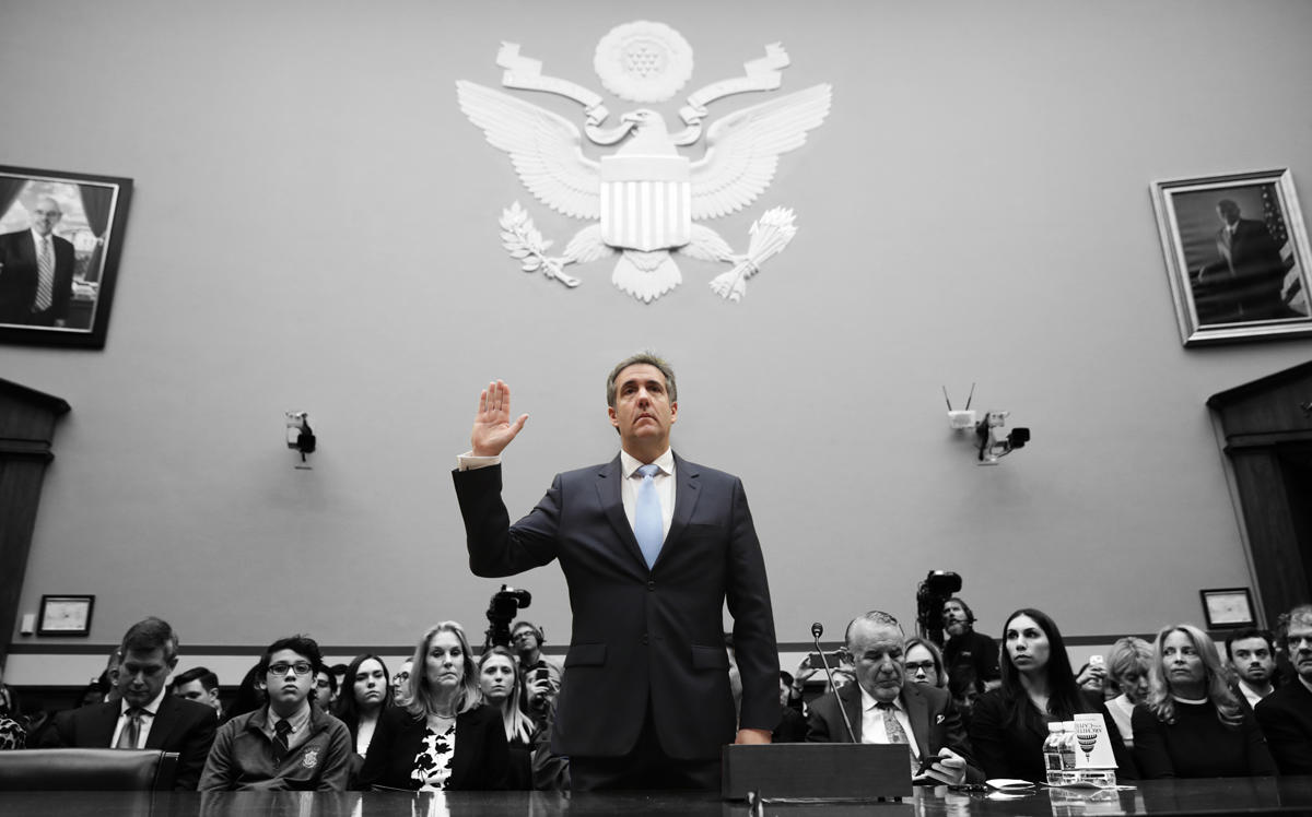 Michael Cohen is sworn in before testifying before the House Oversight Committee on Capitol Hill (Credit: Getty Images)