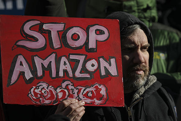Protestors rally against Amazon and the company's plans to move their second headquarters to the Long Island City neighborhood of Queens, at New York City Hall, January 30, 2019 in New York City (Credit: Drew Angerer/Getty Images)