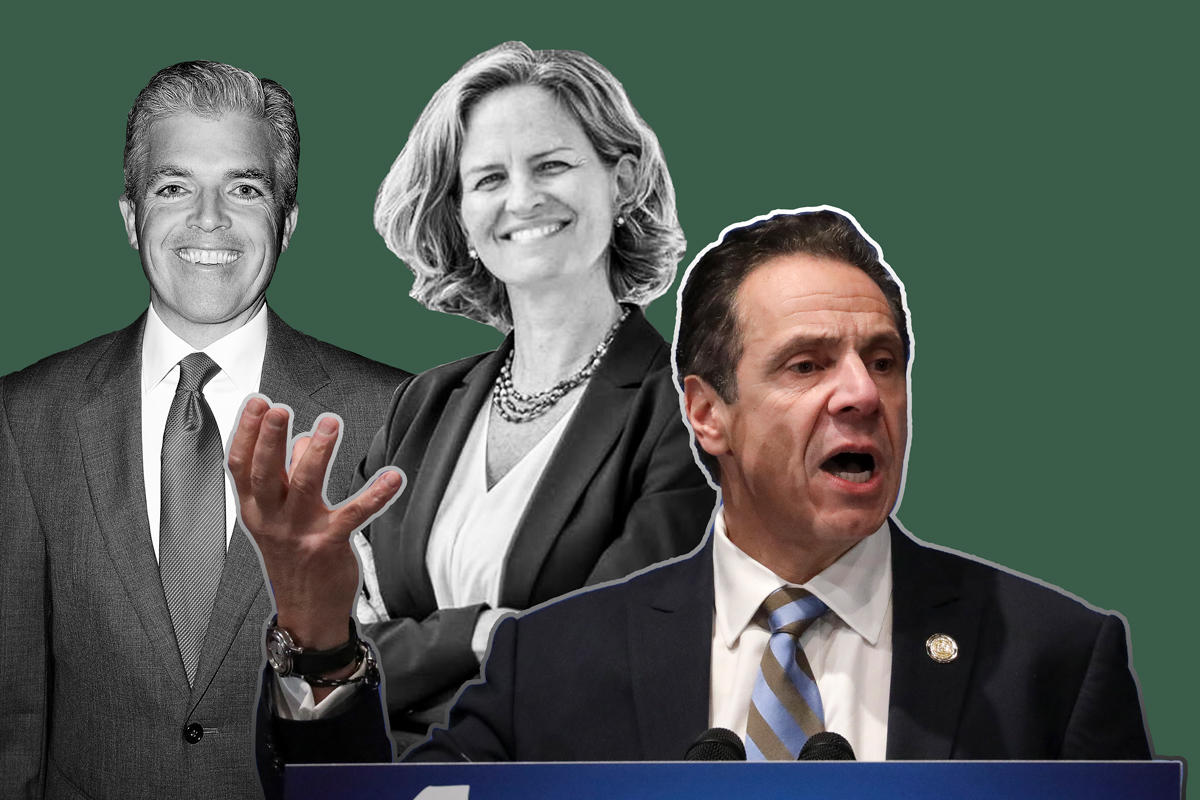 From left: Suffolk and Nassau executives Steve Bellone and Laura Curran with Governor Andrew Cuomo (Credit: Getty Images)
