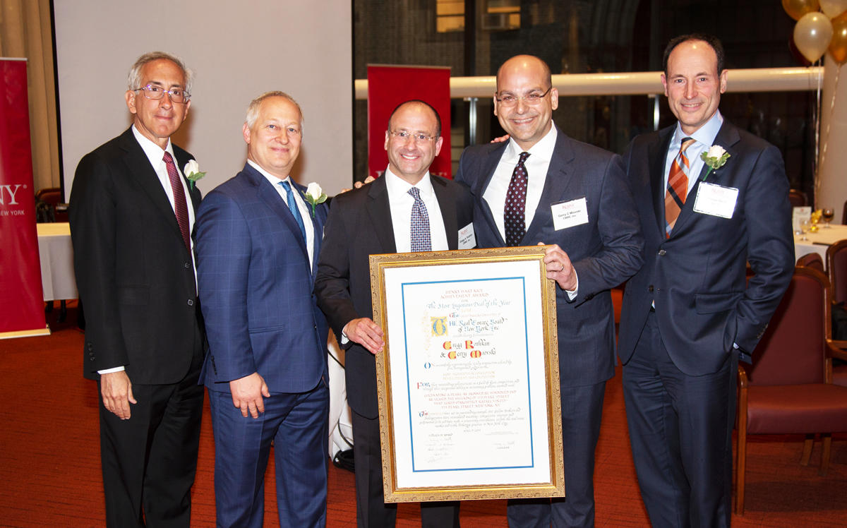 CBRE’s Gregg Rothkin and Gerry Miovski (middle) at REBNY's annual cocktail party Tuesday evening.