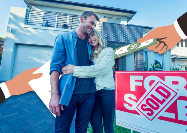 Home buyers in front of a house (Credit: iStock)