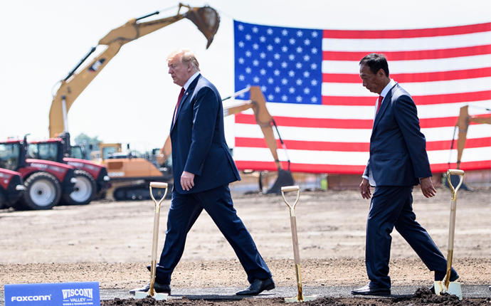US President Donald Trump (L) and Foxconn Chairman Terry Gou leave after a groundbreaking for a Foxconn facility at the Wisconsin Valley Science and Technology Park June 28, 2018 in Mount Pleasant, Wisconsin (Credit: Brendan Smialowski/AFP/Getty Images)