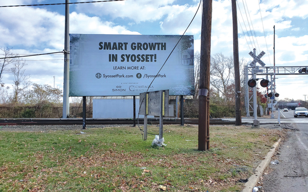 <em>A billboard touting Syosset Park</em>