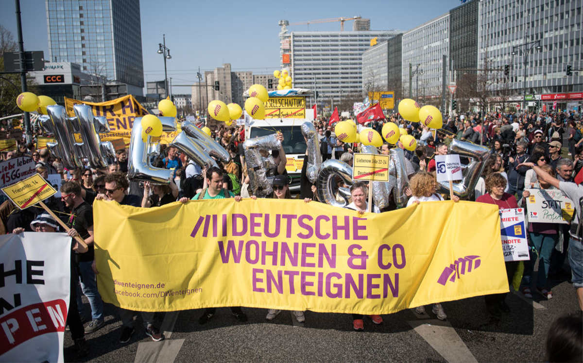 Demonstrators are seen in Berlin's Alexanderplatz protesting the city's rising rent prices in April 2019 (Credit: Getty Images)