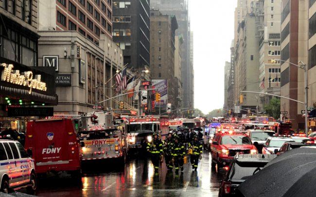 The fire brigade, police and rescue services are on duty near the scene of the accident. At least one person died in a helicopter crash on a skyscraper in New York's Manhattan district (Photo by Benno Schwinghammer/picture alliance via Getty Images)