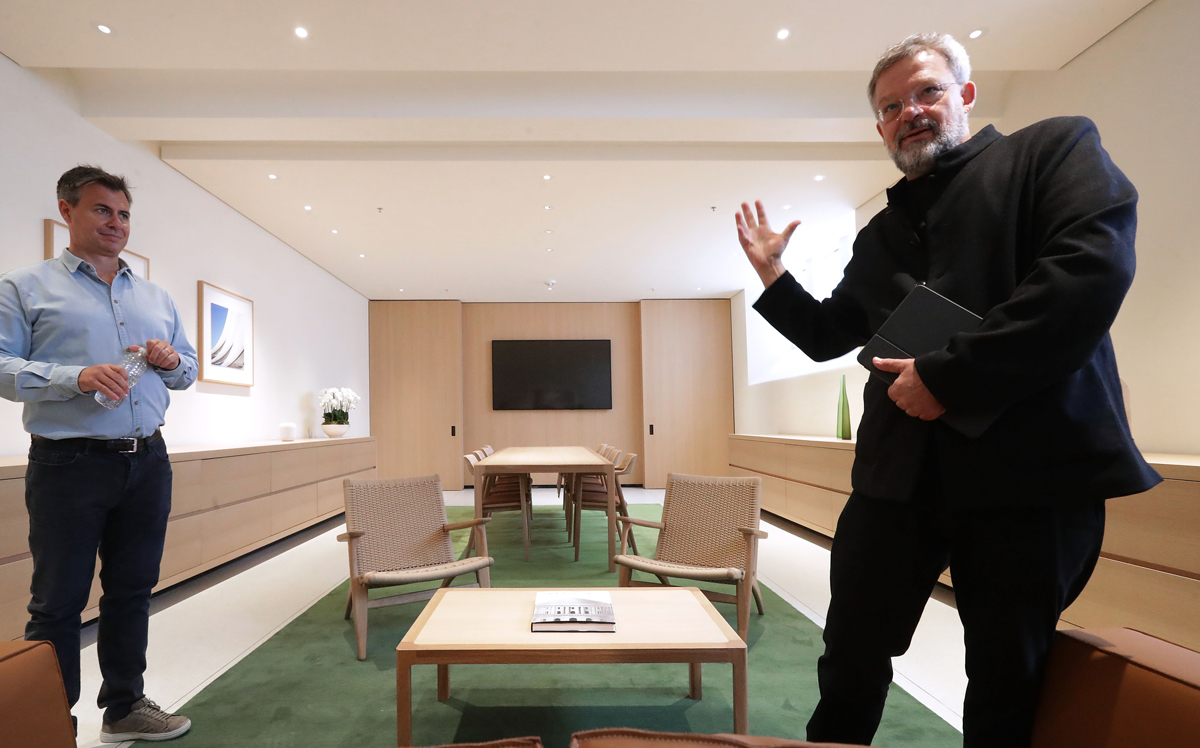 Architect Stefan Behling (right) and Senior Director for Apple Retail and Design Chris Braithwaite talk about the Board Room part of Apple Carnegie Library in Washington, DC (Credit: Getty Images)