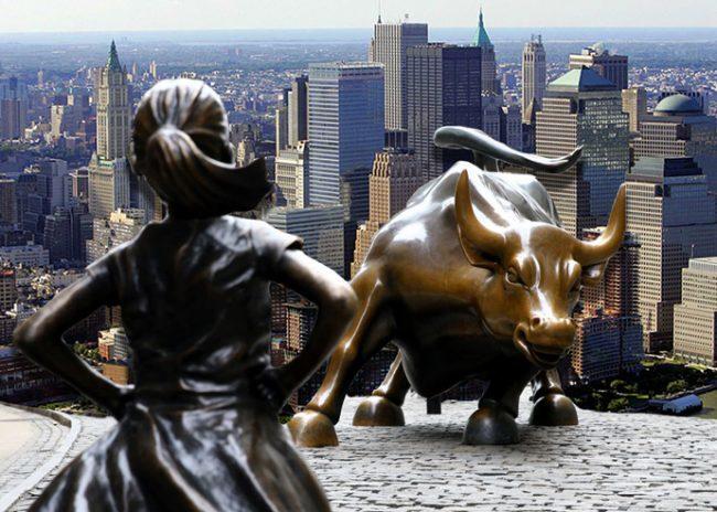 Fearless Girl and Charging Bull statues, and an aerial view of Battery Park (Credit: Getty Images)