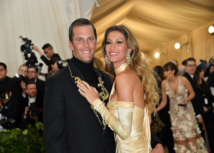 <em>Tom Brady (L) and Gisele Bündchen arrive at the 2018 Met Gala on May 7, 2018, at the Metropolitan Museum of Art in New York. (Angela Weiss/AFP/Getty Images)</em>