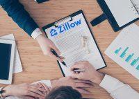 Zillow reports $880M loss on failed home-flipping business