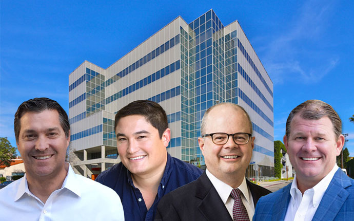 From left: Mark R. Laderman, Collin R. Komae, Walter P. Schmidt, and Christopher Peatross, with the $30 million office building bought by Rockwood and Artisan