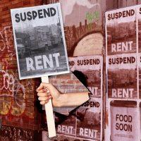 A photo illustration of rent strike wheat paste posters (Credit: Getty Images, iStock)