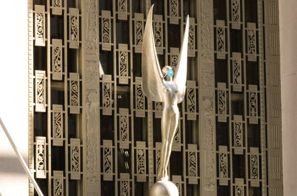 Photo illustration of the statue at the entrance of the Waldorf Astoria