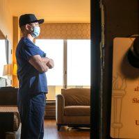 An essential worker staying at USC Hotel in Los Angeles (Credit: Robert Gauthier / Los Angeles Times via Getty Images)