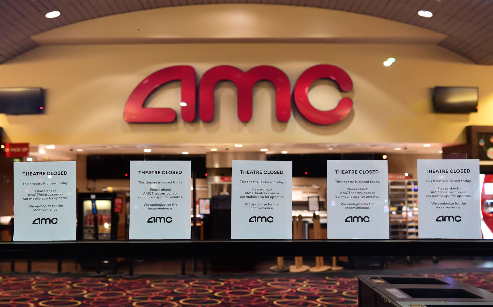 AMC is pressed to get eyes back in front of their screens starting in July — but not without some cuts ahead. (Getty)