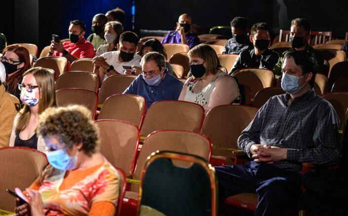 The audience watches a play at The Anne Bernstein Theater in The Theater Center (Getty)