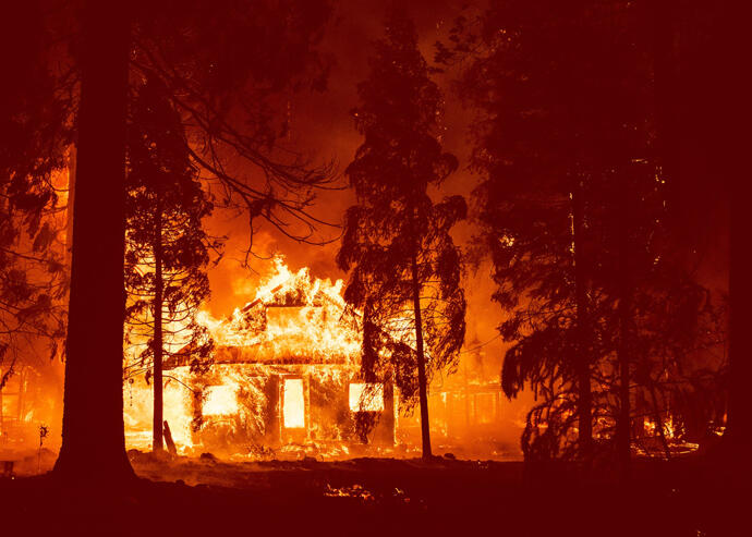 A home burning in the Sierra Nevada earlier this week (Getty)