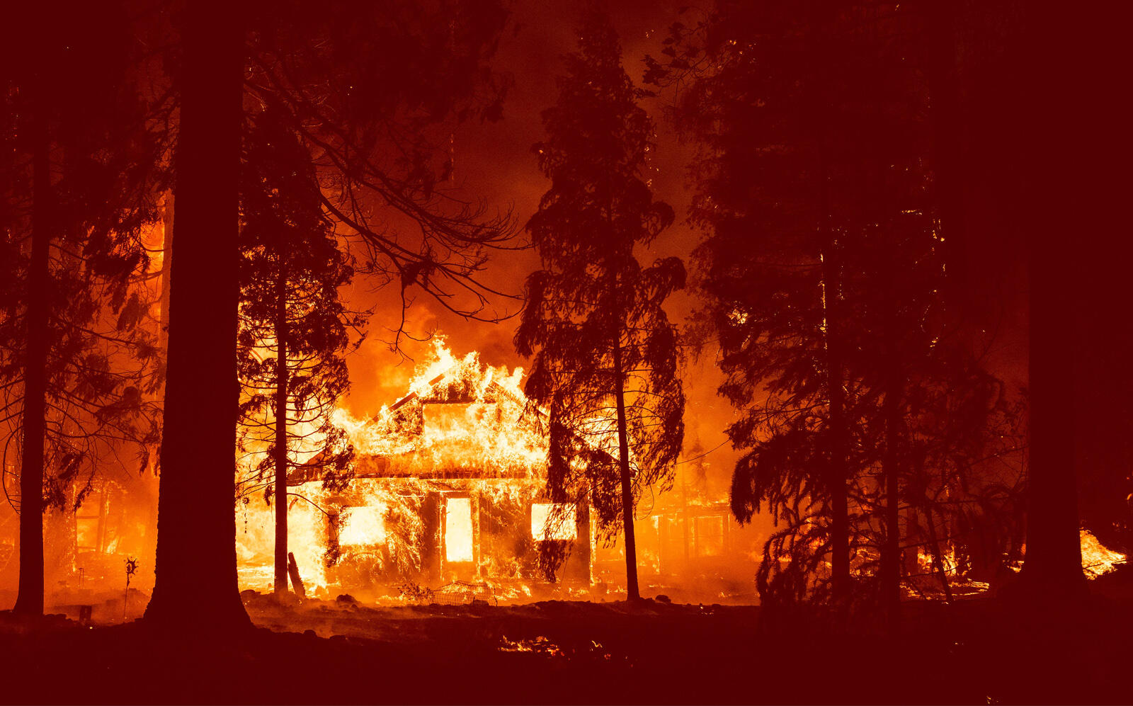 A home burning in the Sierra Nevada earlier this week (Getty)