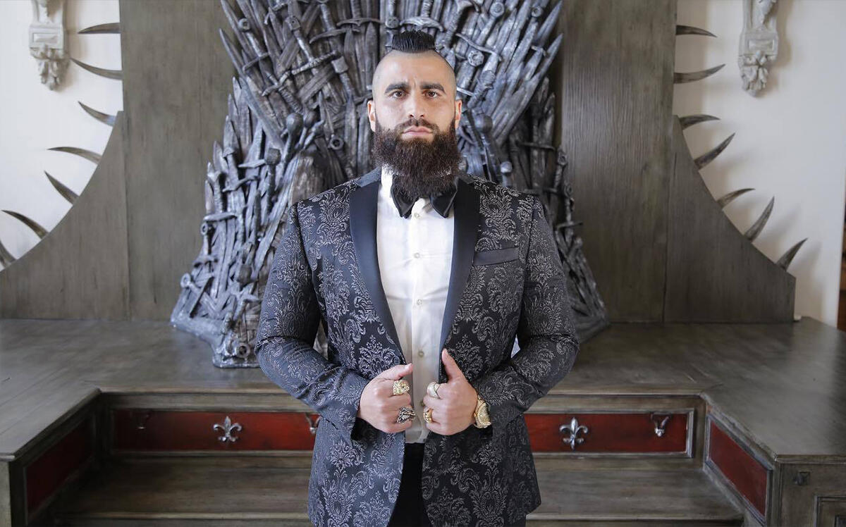 Robert Rivani in front of a replica of the iron throne from the HBO's “Game of Thrones” (Facebook)