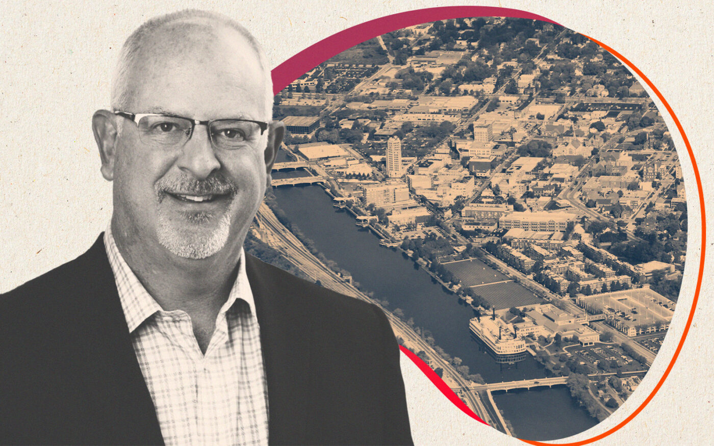 Fiduciary Real Estate Development's Brett Miller with aerial view of Downtown Elgin