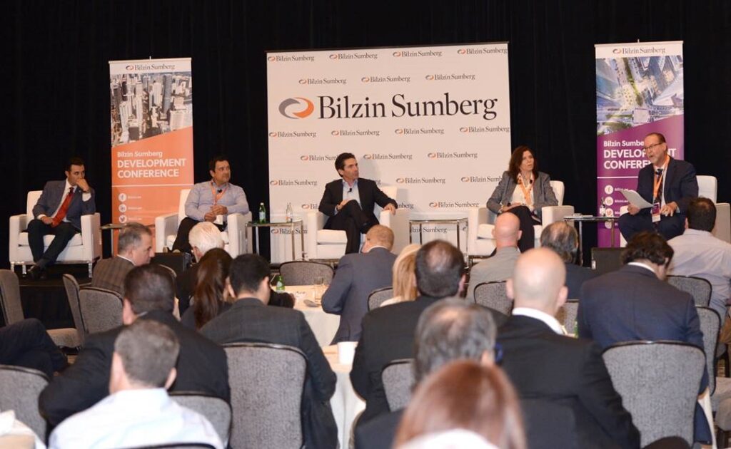 Carter McDowell moderates a panel of experts, including Victor Ballestas, Anthony De Yurre, Arden Karson, and Camilo Miguel Jr., during The Aging Condo Conundrum panel at the Bilzin Sumberg Development Conference.