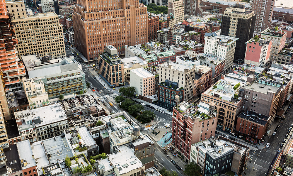 Aerial view of New York City above Finn Square and along West Broadway street, in Tribeca