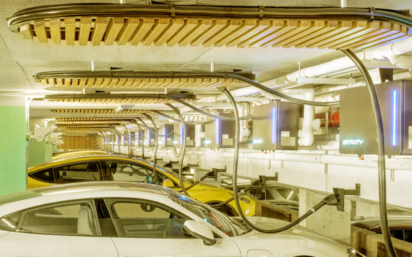 Gravity Mobility’s electric vehicle chargers at Related’s Manhattan Plaza (Getty, Related)