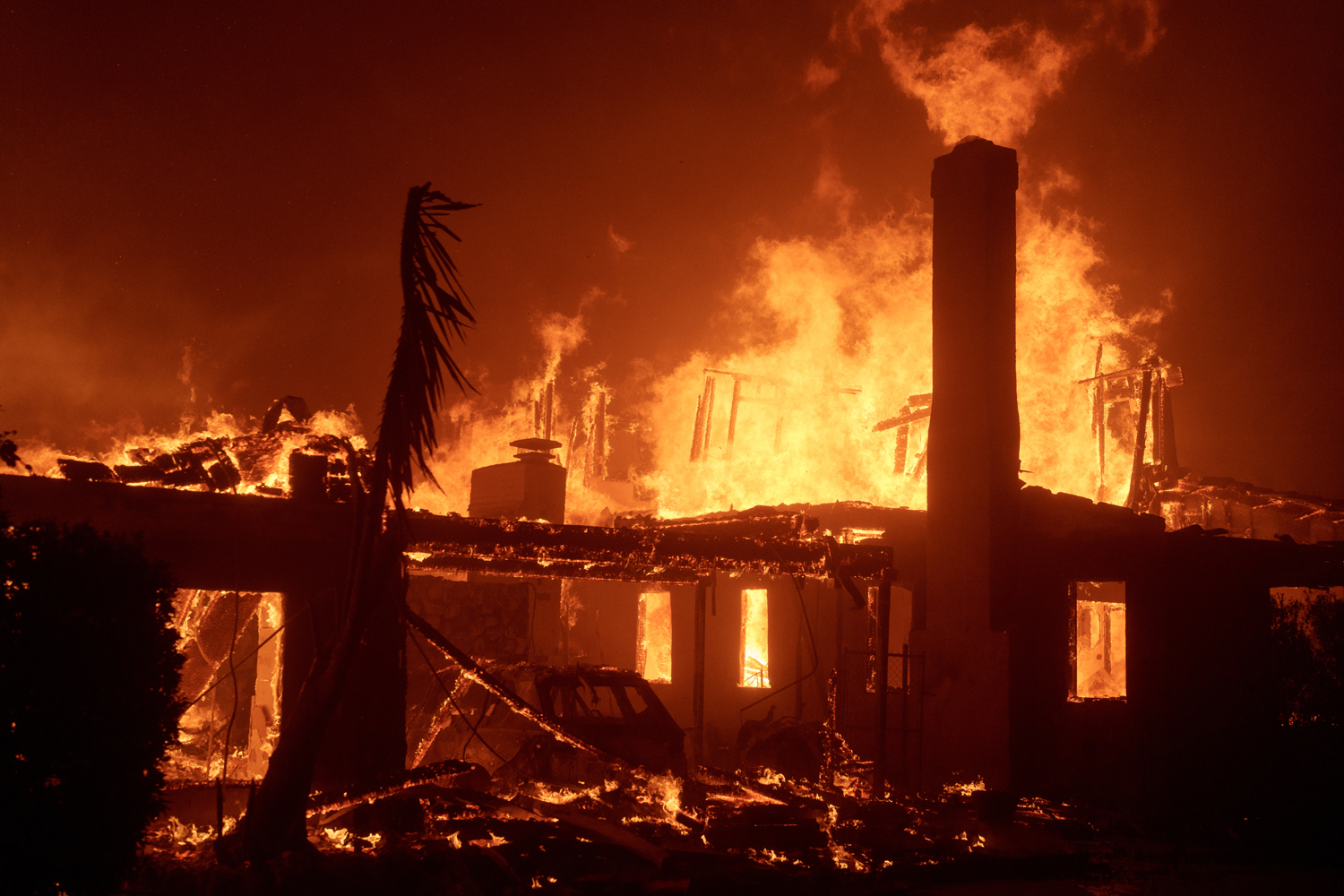 Fires whipped by 99 mph gusts destroy Southern California homes, businesses