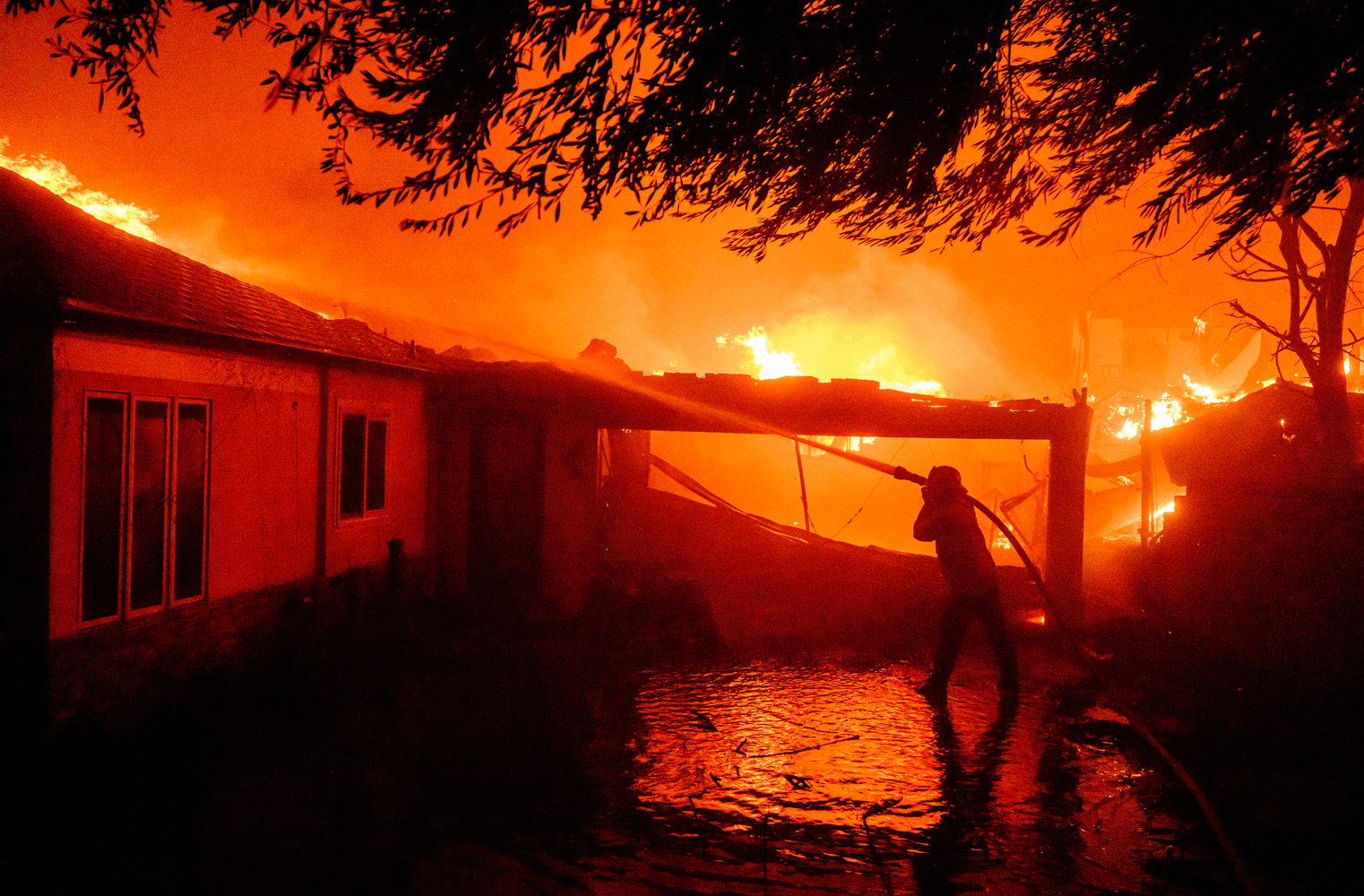 Fires whipped by 99 mph gusts destroy Southern California homes, businesses