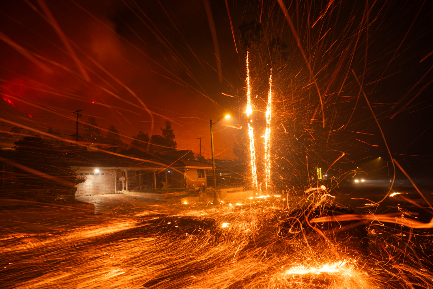 Fires whipped by 99 mph gusts destroy Southern California homes, businesses