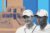 Hank Haney and Tiger Woods with 921 Sheridan Road